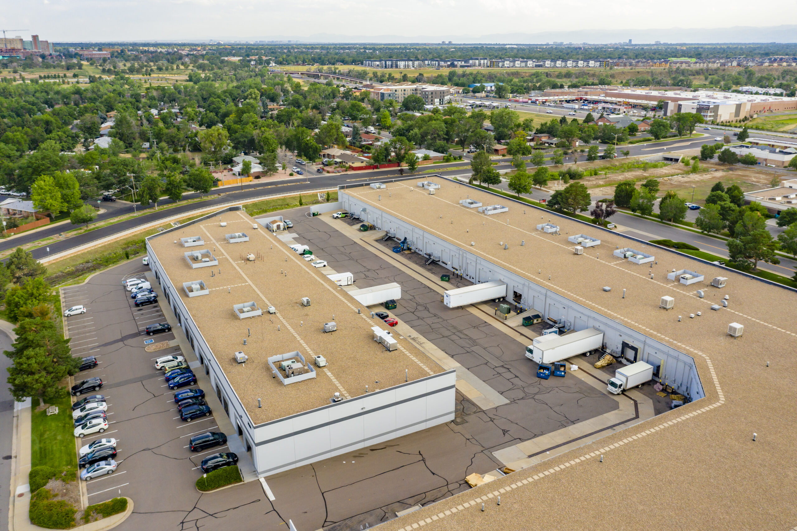 Aerial photo of light-industrial property Commerce Square, showing truck bays, parking, and surrounding trees